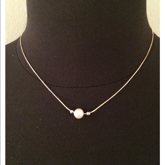 Single pearl necklace.