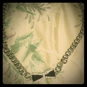 A black bow diamond costume jewelry necklace.