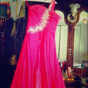 This is a pink prom dress that has been wore once.
