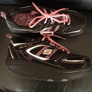 Pink and black Sketchers shape ups