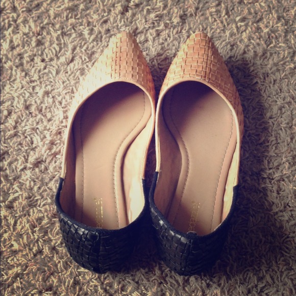 Nude and black woven flats