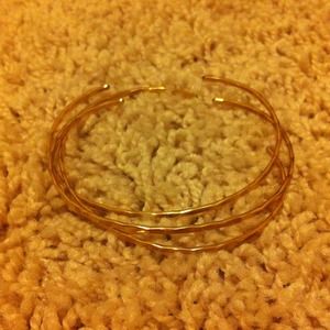 Three hammered gold cuffs