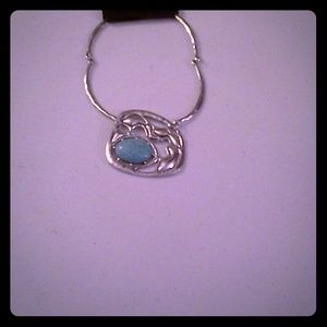 Rustic abstract turquoise stone in silver setting