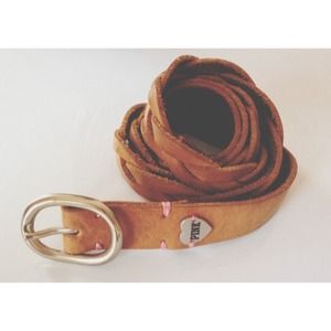 VS pink beside leather belt