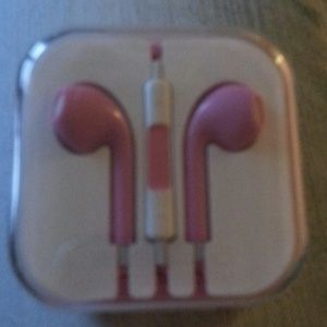 Pink head phones with adjustable volume control