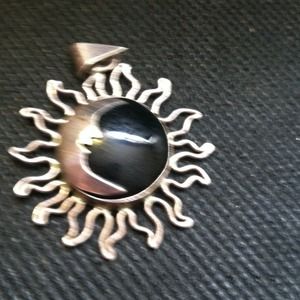 Silver moon pendant with black face