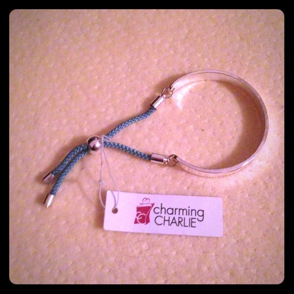 Never worn bangle with blue rope tassels