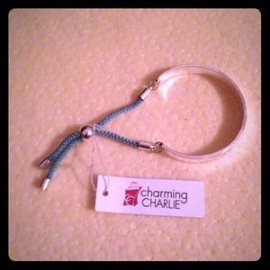 Never worn bangle with blue rope tassels