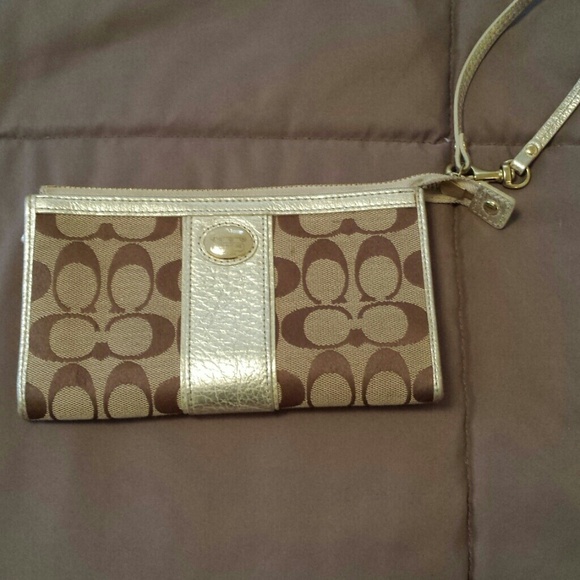 Coach tan and gold wristlet