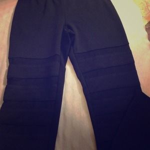 Black leggings with mesh stripes at bottom of legs