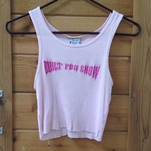 Pink mid-drift tank.