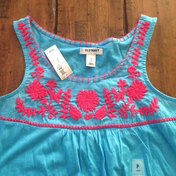 Turquoise sleeveless tank with pink flower design