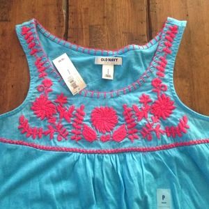 Turquoise sleeveless tank with pink flower design