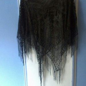 A poncho that is lace