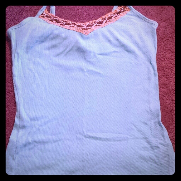 Blue tank with brown stitched detail along top