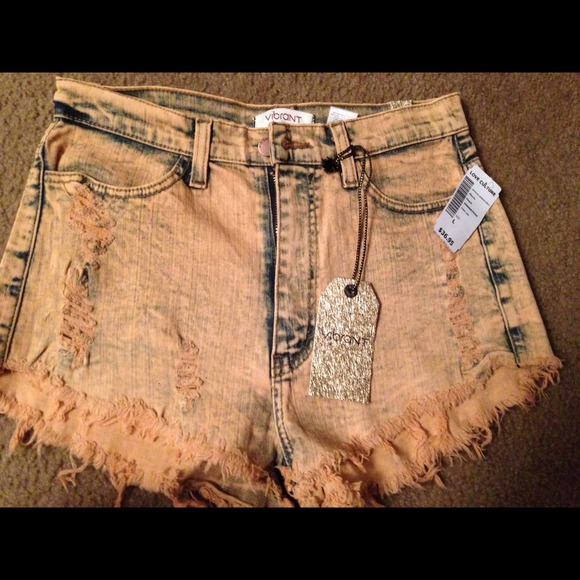 High waisted salmon/peachy colored denim shorts. - Picture 1 of 3