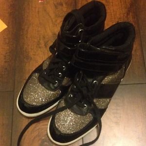 Black and gold high top sneakers