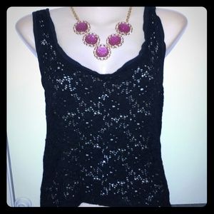 SOLD! Bebe high low black tank
