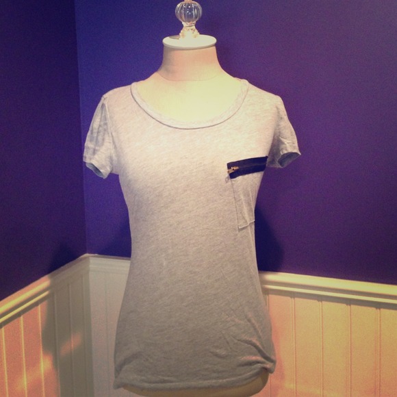 Grey t-shirt with black zipper detail.