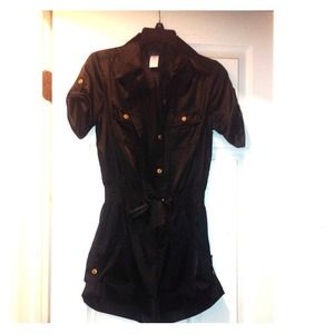 A black jumpsuit  with gold buttons !