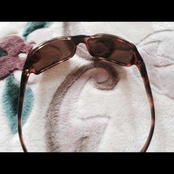 Ray- Ban sunglasses.