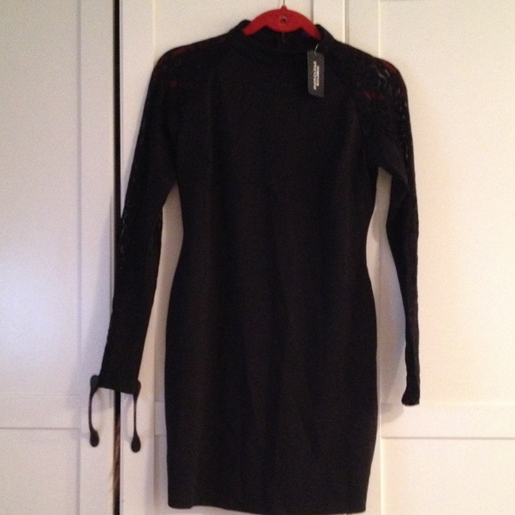 Short length dress. Black long sleeves. With lace