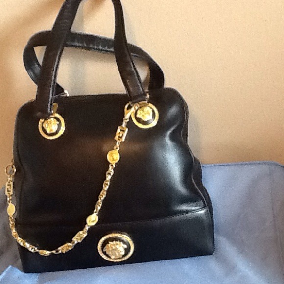 Handbag is 14 wide 4" by 12 high and leather