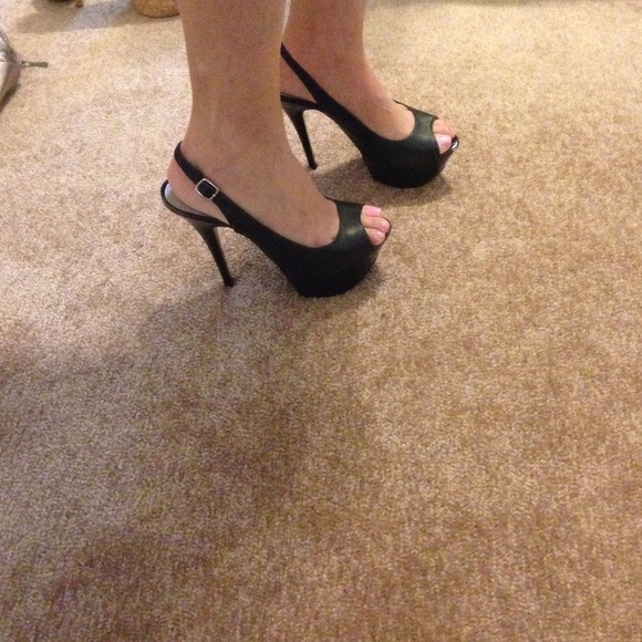 Black sling back open toe shoe