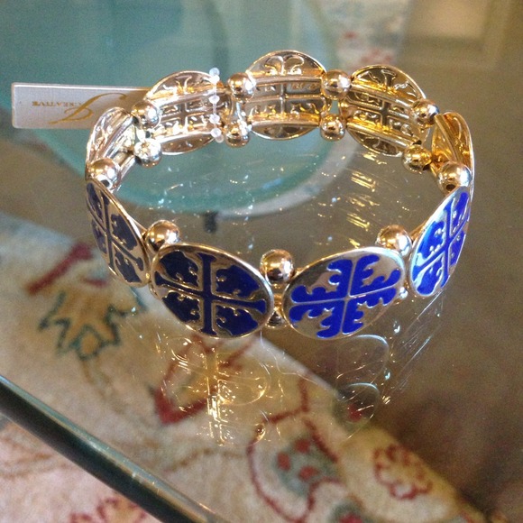 Gold tone elastic bracelet with royal blue accent