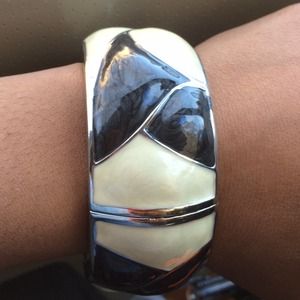 Large black and white color-block bangle.