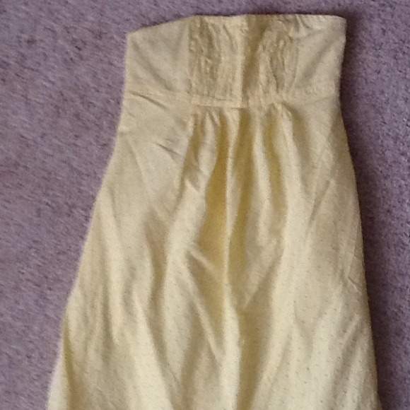 Yellow dress with pink stitching