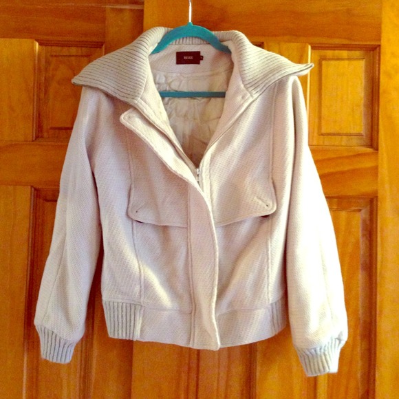 Fluffy beige warm cozy jacket.