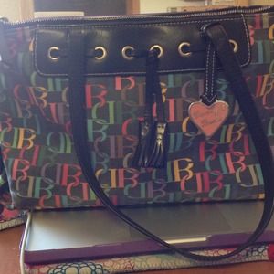 Dooney & Bourke black tassel zip top bag with logo