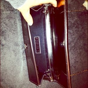 Silver clutch ...excuse the kitty paw lol .