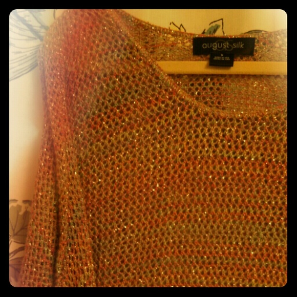 Knit sweater with silver laced in.