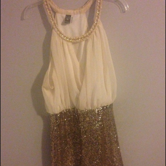 This creme an gold dress is perfect for any event!