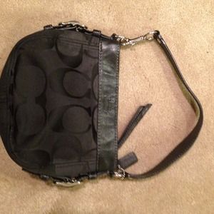 Small/medium sized coach purse. Black on black