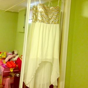 Super soft feminine Hi-Lo sequins strapless dress.