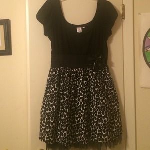Black and white polkadot dress with flower