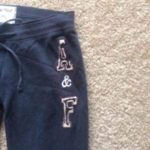 A&F navy sweat pants.
