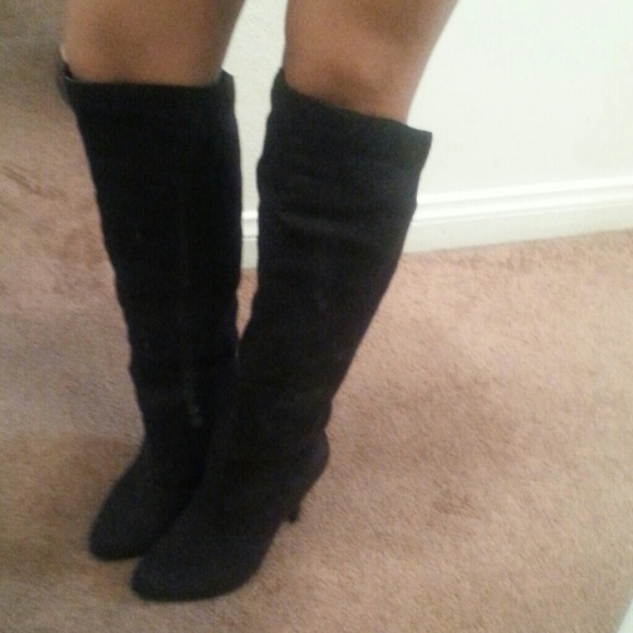 Knee high black boots.