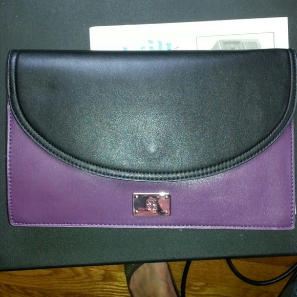 NY&C clutch purse.black/purple color.