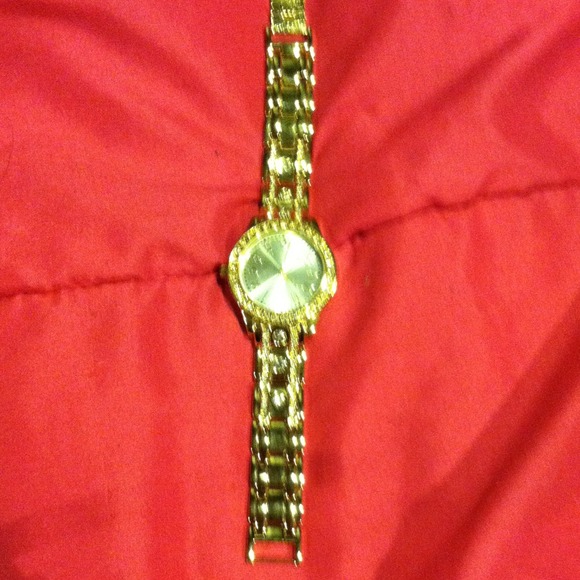 Gold plated watch with crystals.