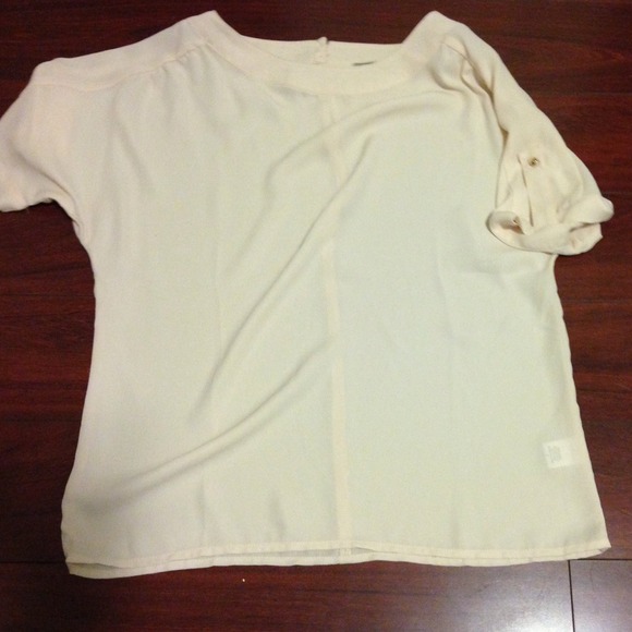 Beige top with gold accents