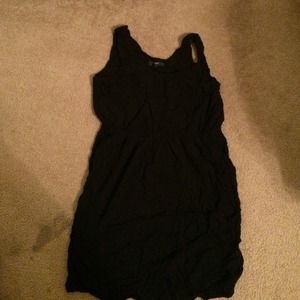 Sleeveless black dress.