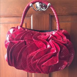 Red handbag with ruffle detail