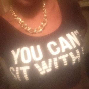 Gold chain   And you can't sit with us shirt