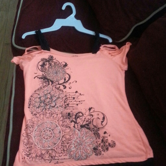 A pink and black ripped tee