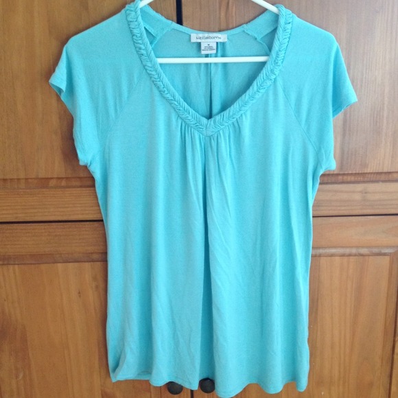 Blue v-neck shirt.