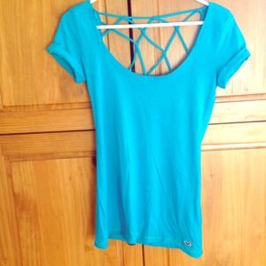 Blue deep cut shirt.